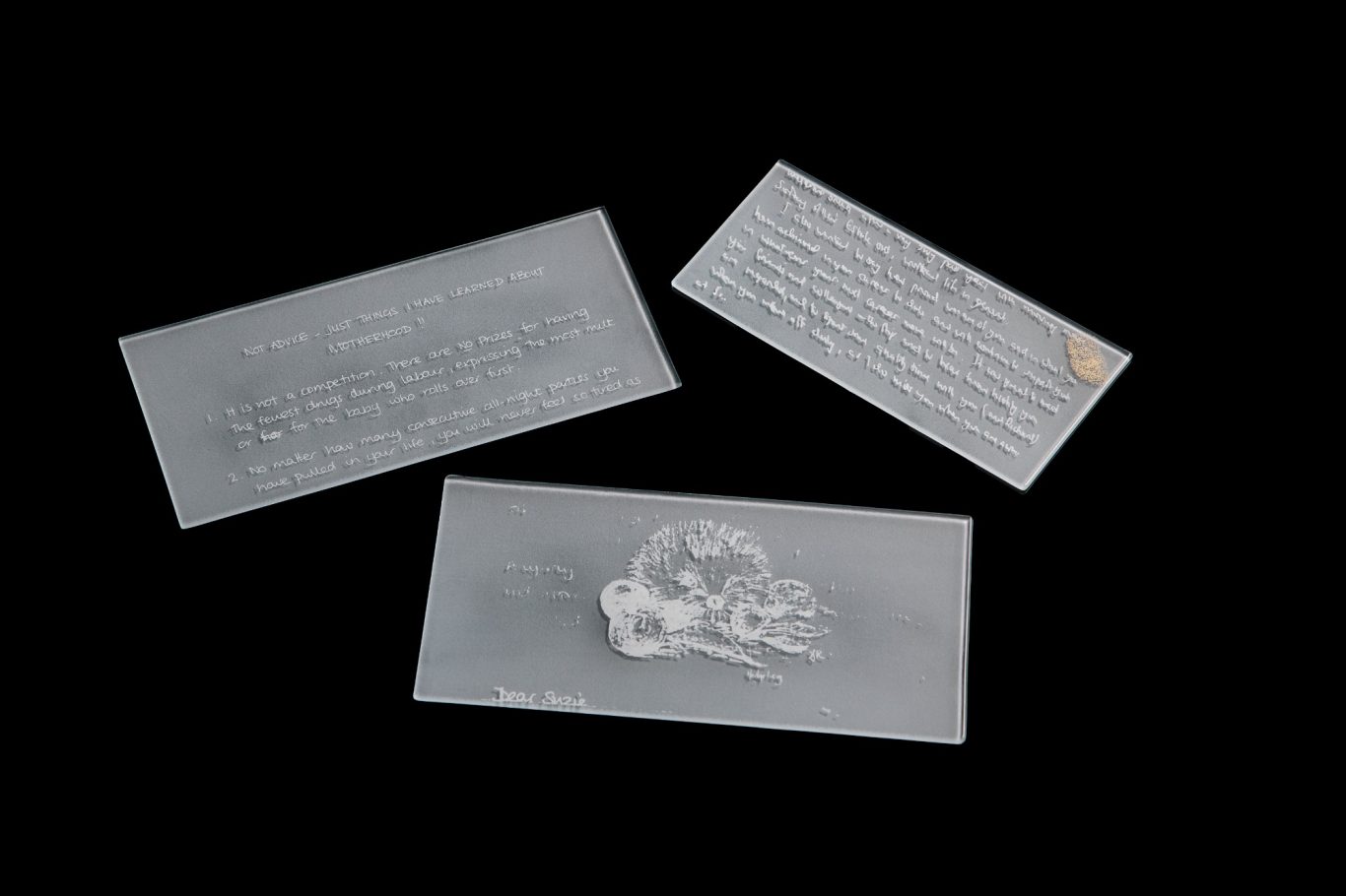 The Memory of what Remains White enamel screen printed glass letters